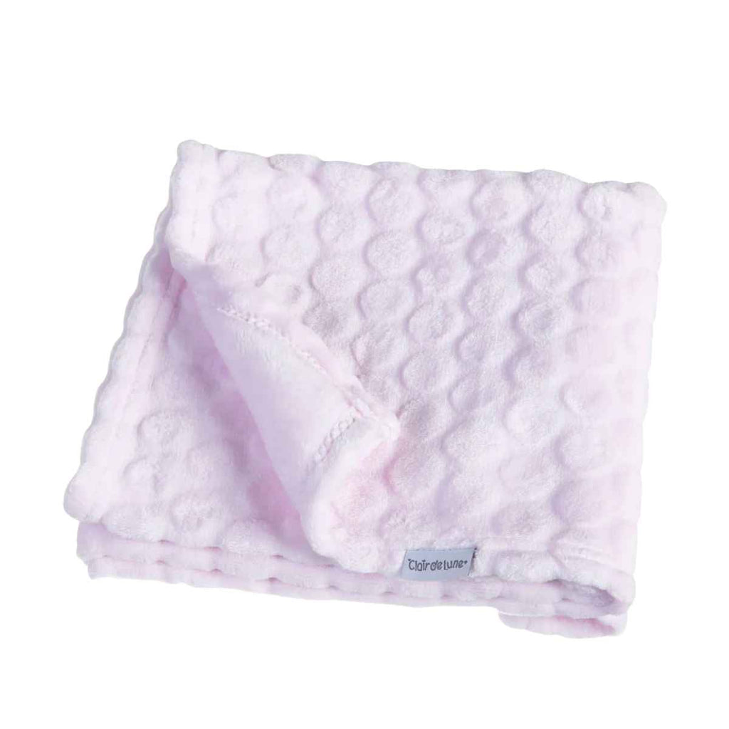 Pink marshmallow textured blanket with a Clair de Lune brand tag on a white background