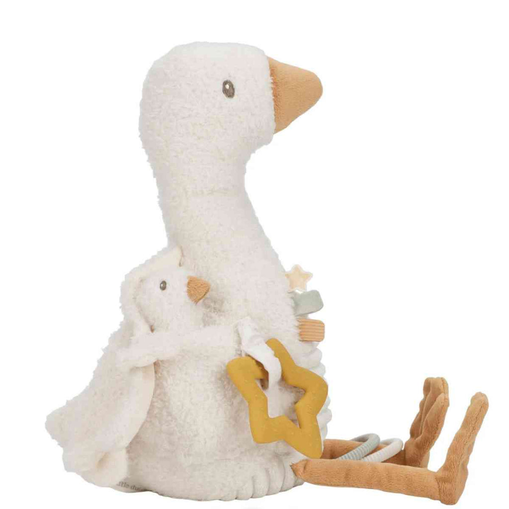 Plush toy goose with a smaller goose and activity toys on a white background