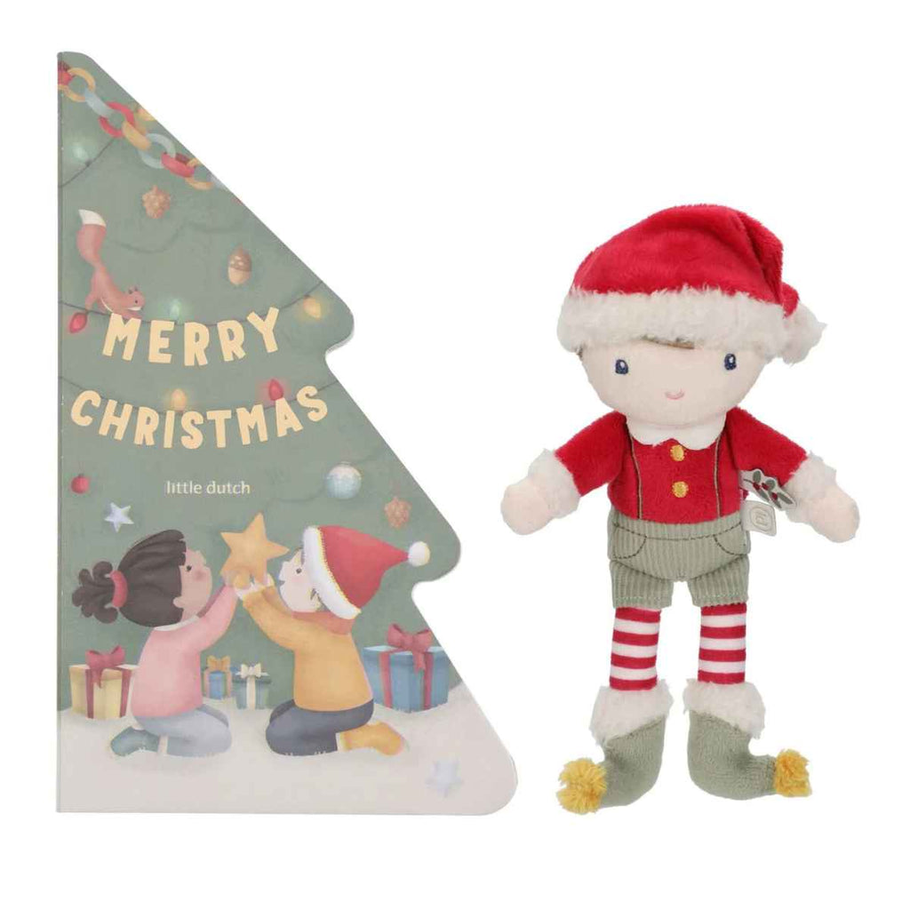 Plush toy elf and Christmas-themed book on a white background