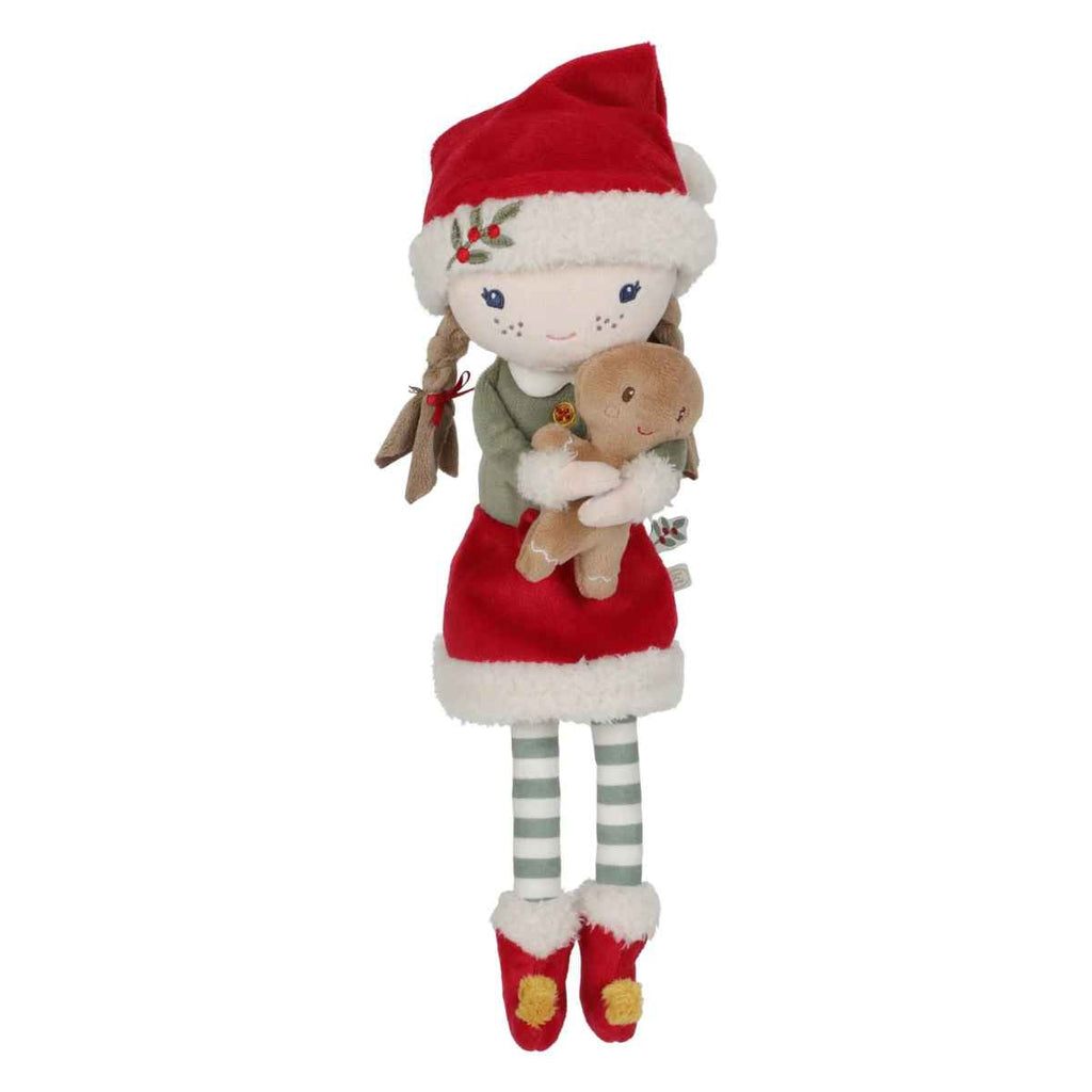 Plush toy with a red Santa hat and dress holding a gingerbread man on a white background