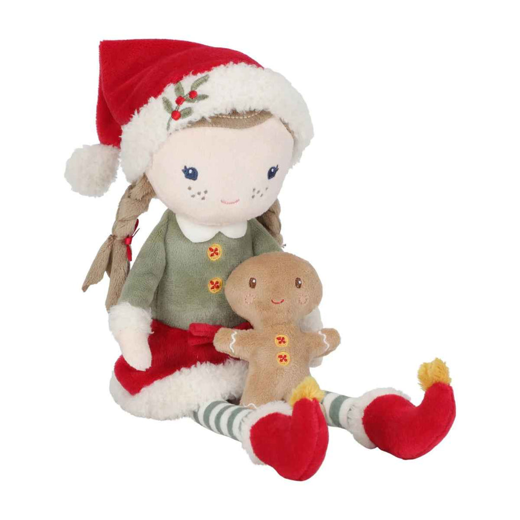 Plush toy elf with a gingerbread man on a white background