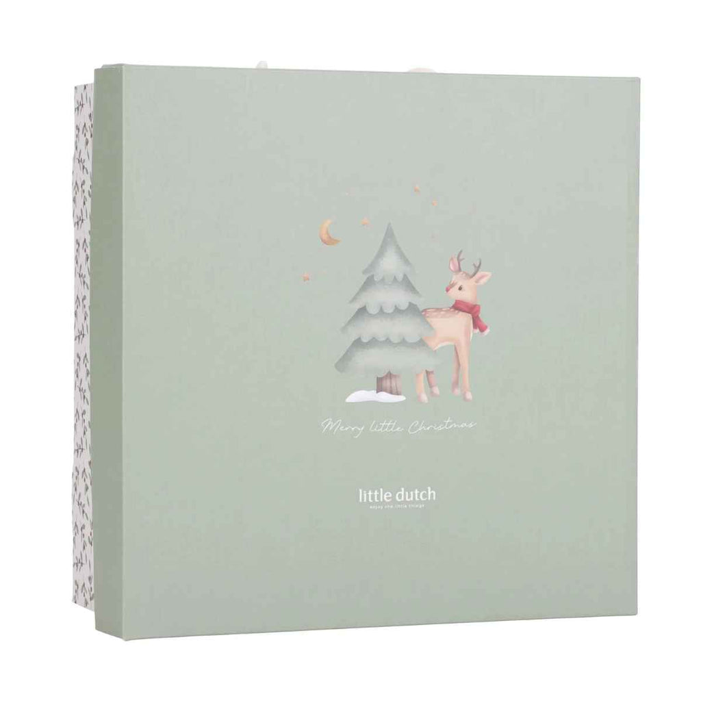 Product packaging with a deer and Christmas tree illustration and 'little dutch' branding on a light green background