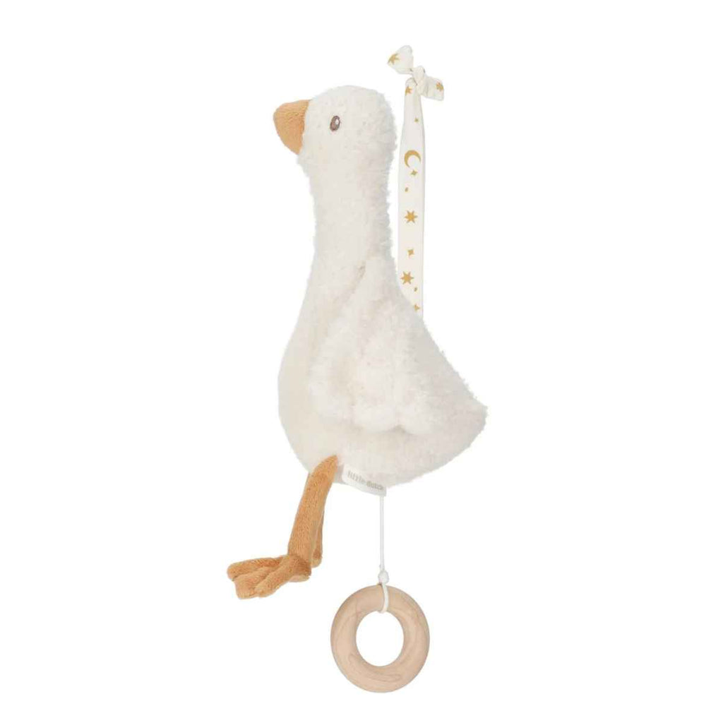 White goose-shaped plush music box with a wooden ring on a white background