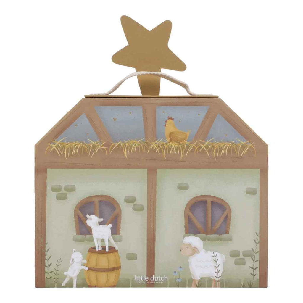 Decorative toy nativity barn with animals on a white background