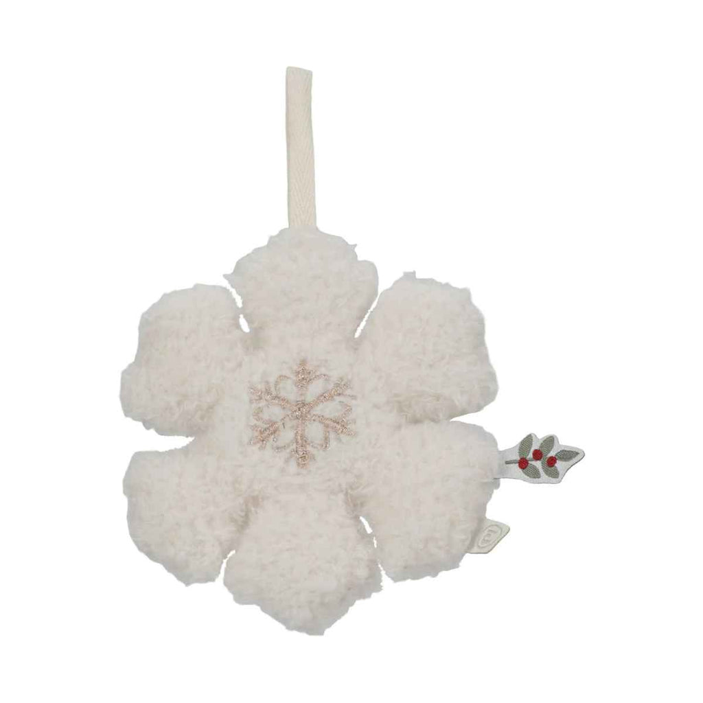 White snowflake ornament with a red berry tag on a white background
