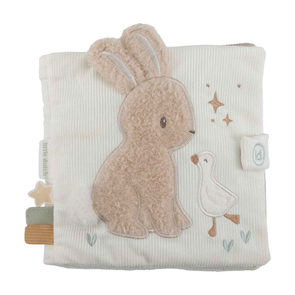 Soft activity book with bunny and a goose on the front on a white background.