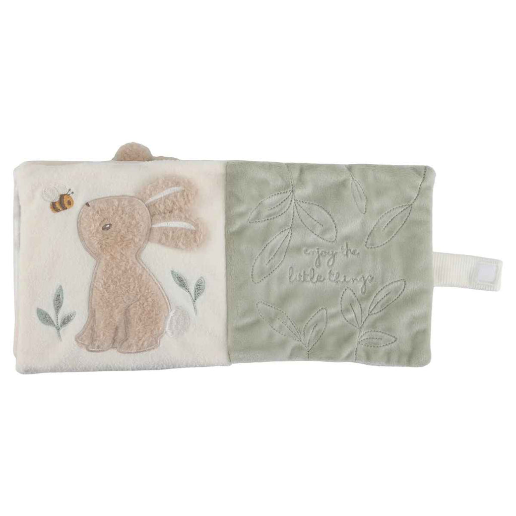 Book with a bunny on left page and leaves on right page