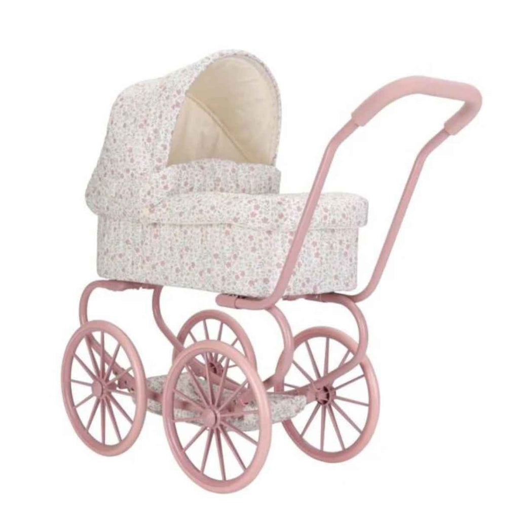 Pink vintage-style doll pram with floral fabric on a white background