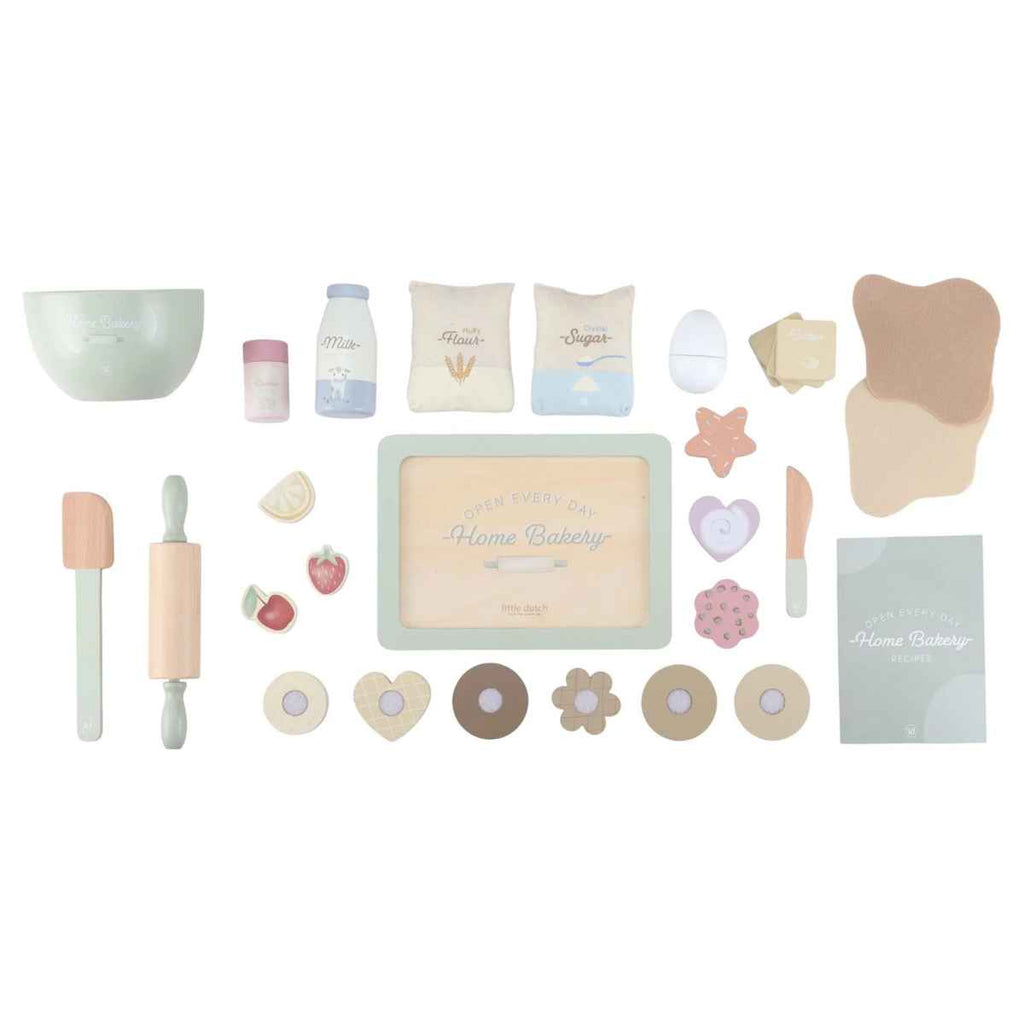 Collection of baking-themed toys and tools on a white background