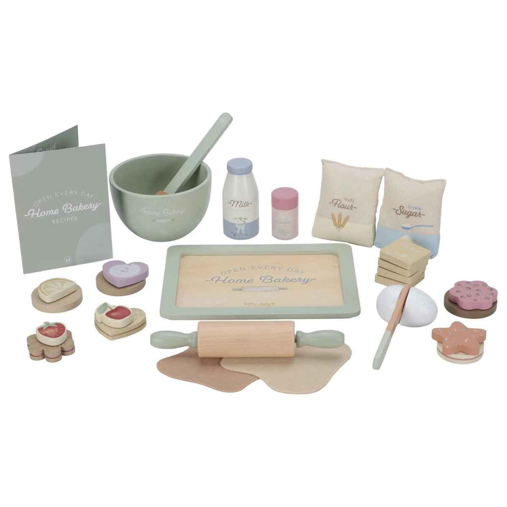 Set of toy baking items including a rolling pin, bowls, and utensils on a white background