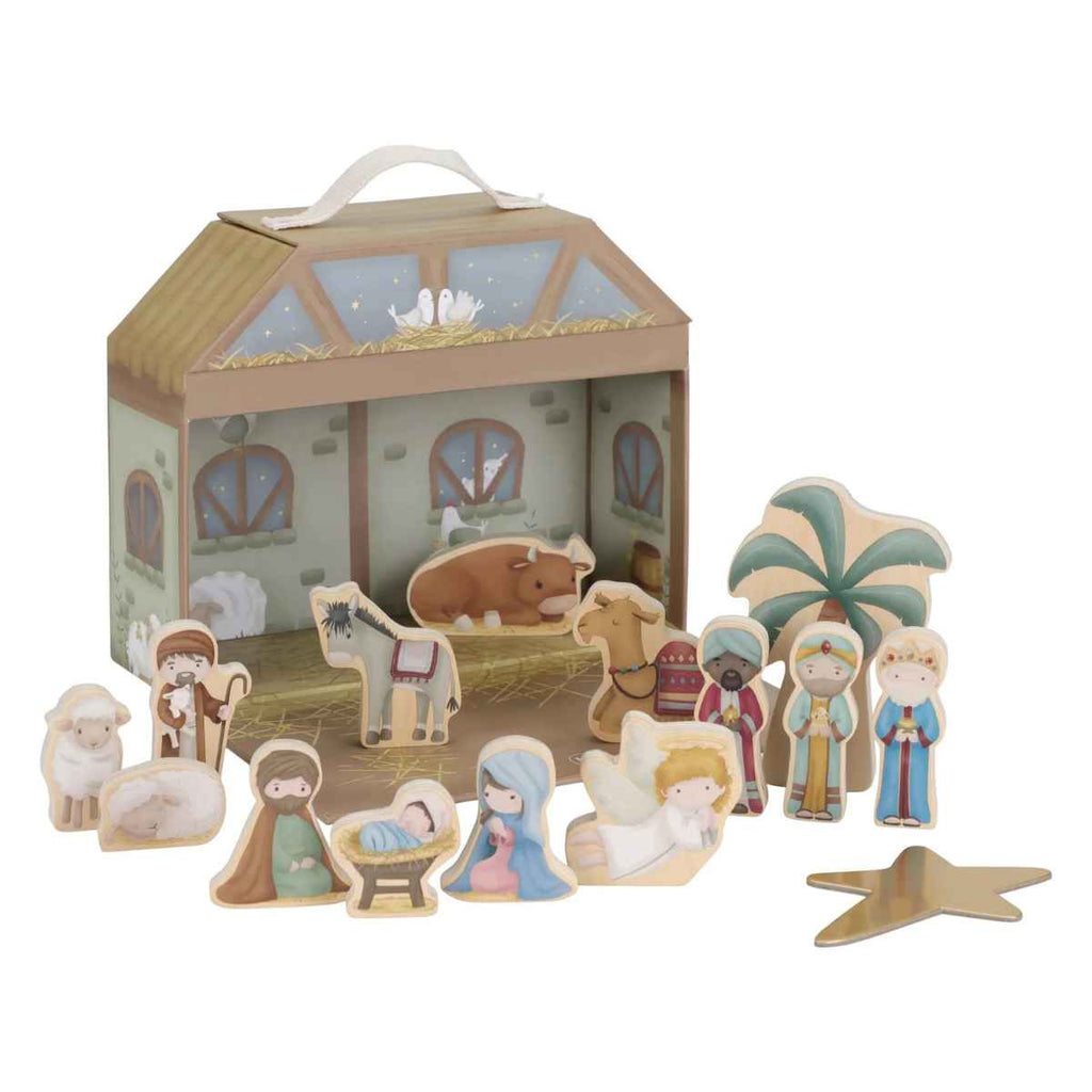 Wooden nativity set with figures and stable in front of packaging