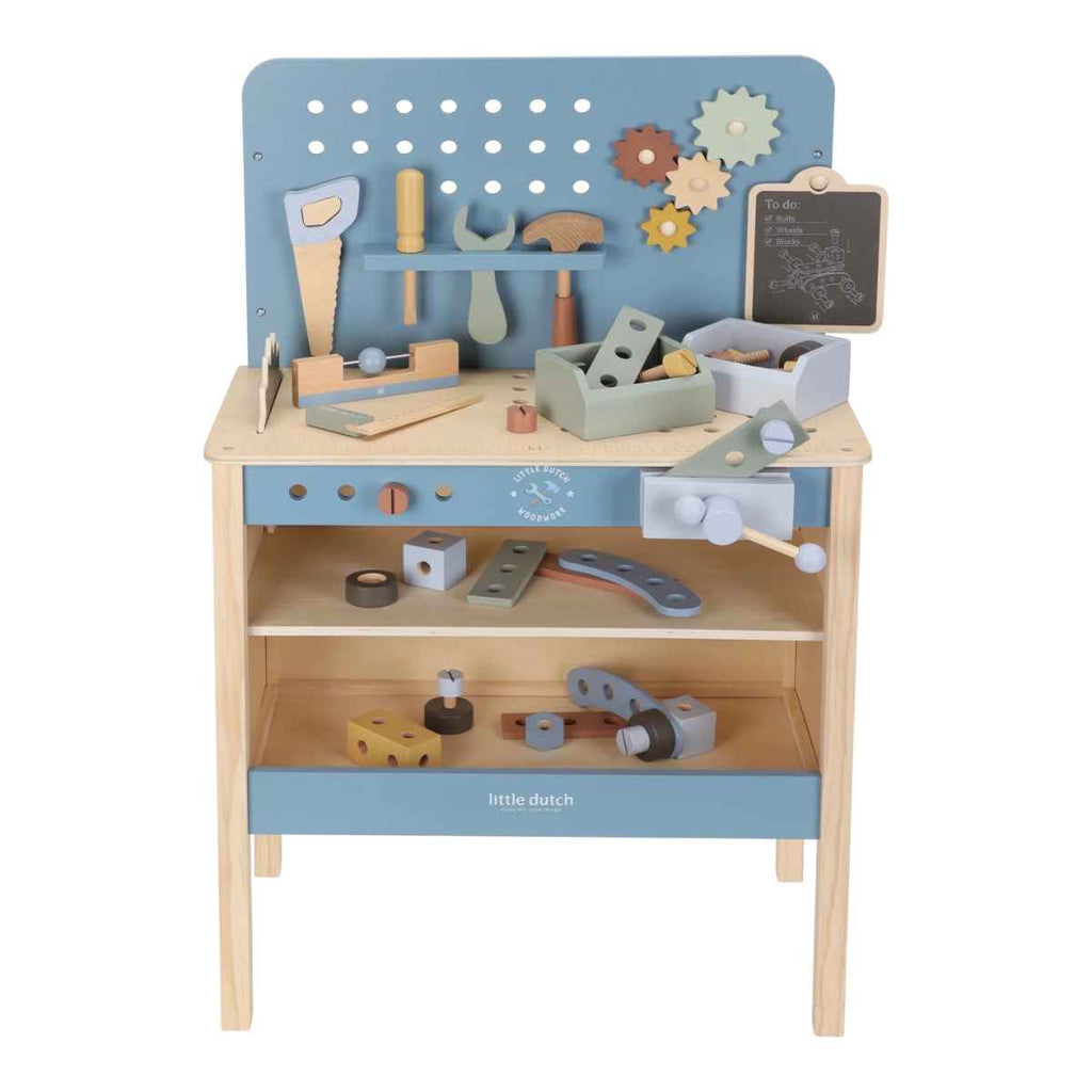 Wooden toy workbench with tools and accessories on a white background