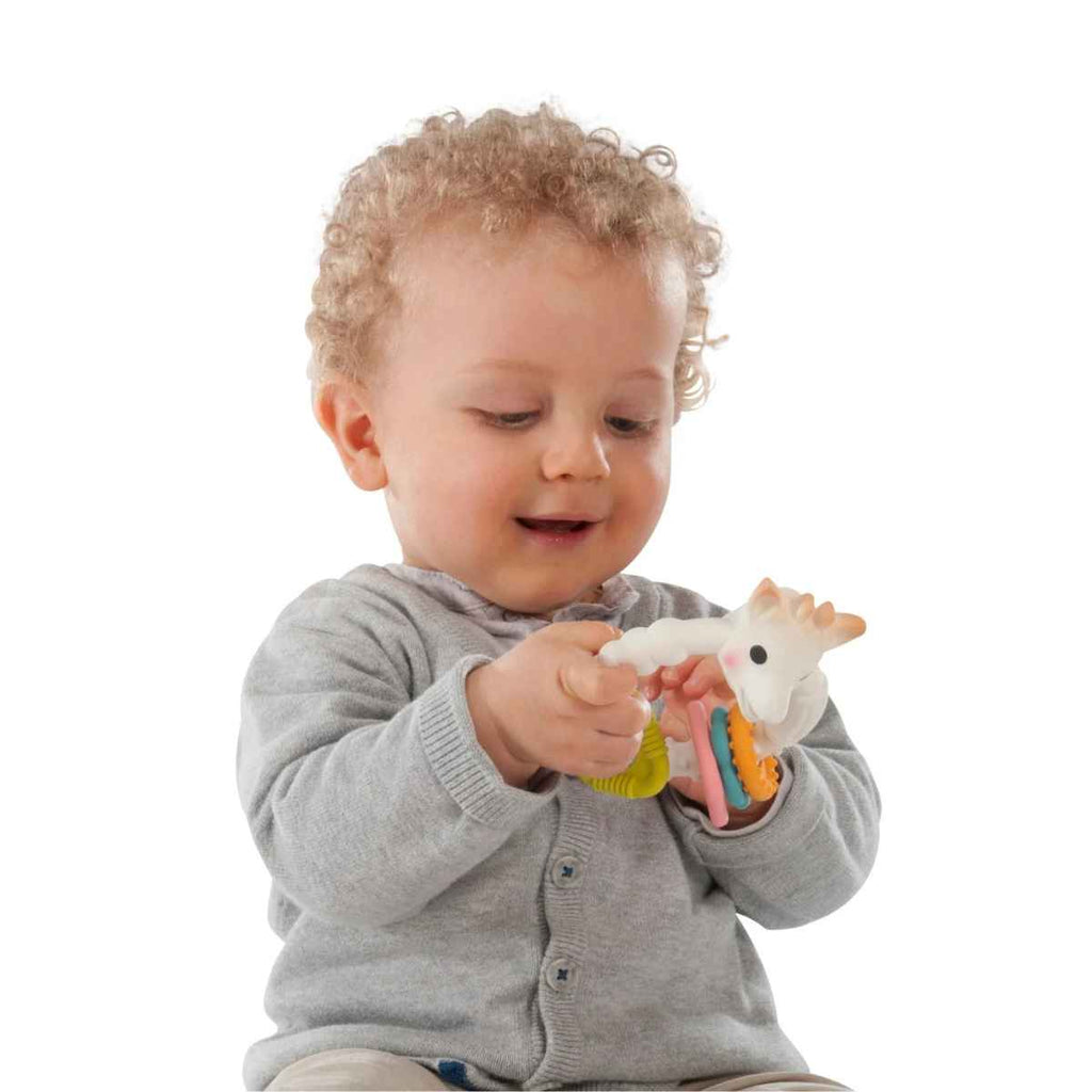 Sophie la girafe® | Child Playing With Multi-textured Teether | ChocoLoons
