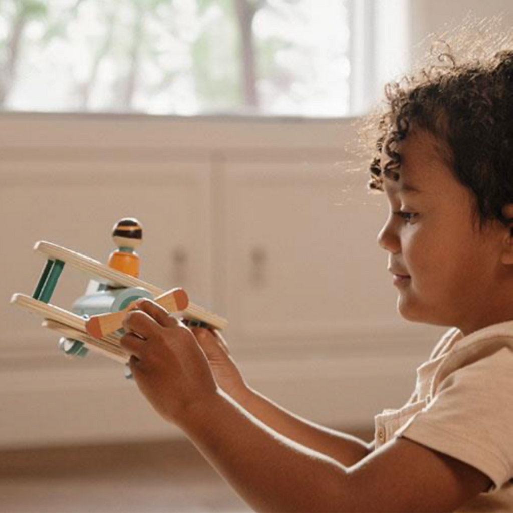 Little Dutch | Boy Playing With Airplane Toy | ChocoLoons