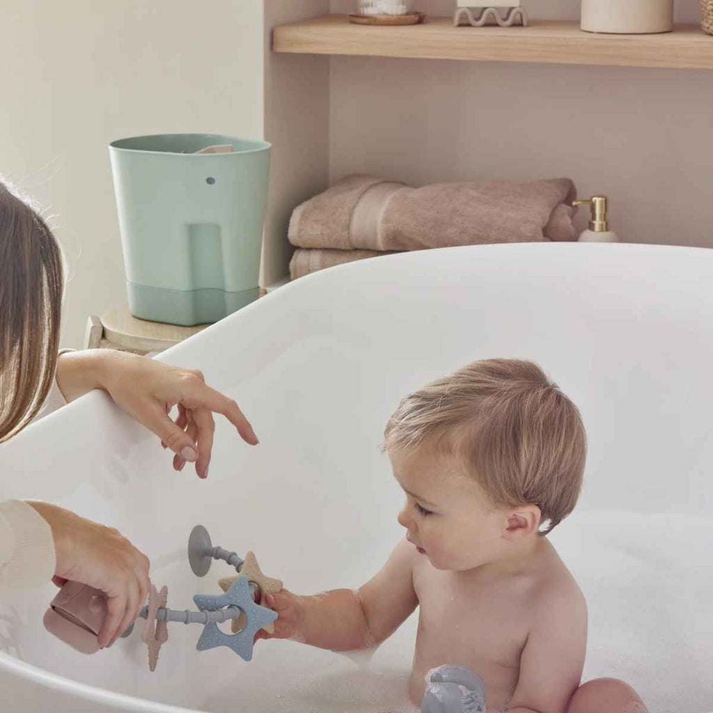Shnuggle | Child Playing With Stick N' Play Star Toy In Bath | ChocoLoons