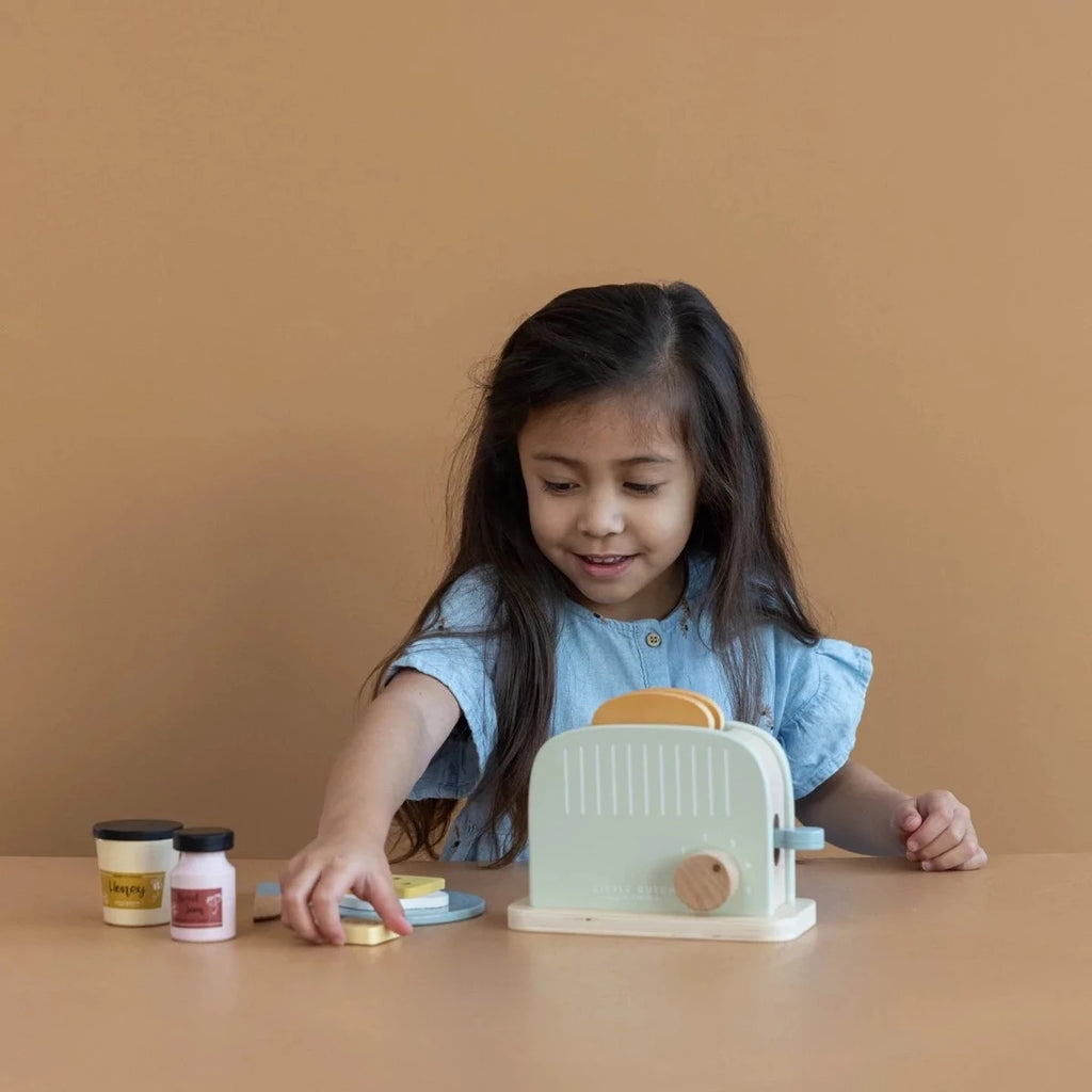 Girl Playing With Little Dutch Wooden Toaster Set | ChocoLoons