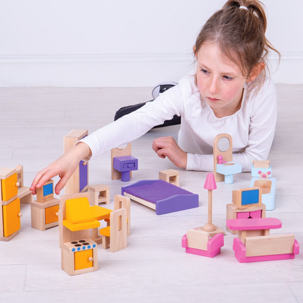Girl Playing With Bigjigs Wooden Dolls Furniture | Chocoloons