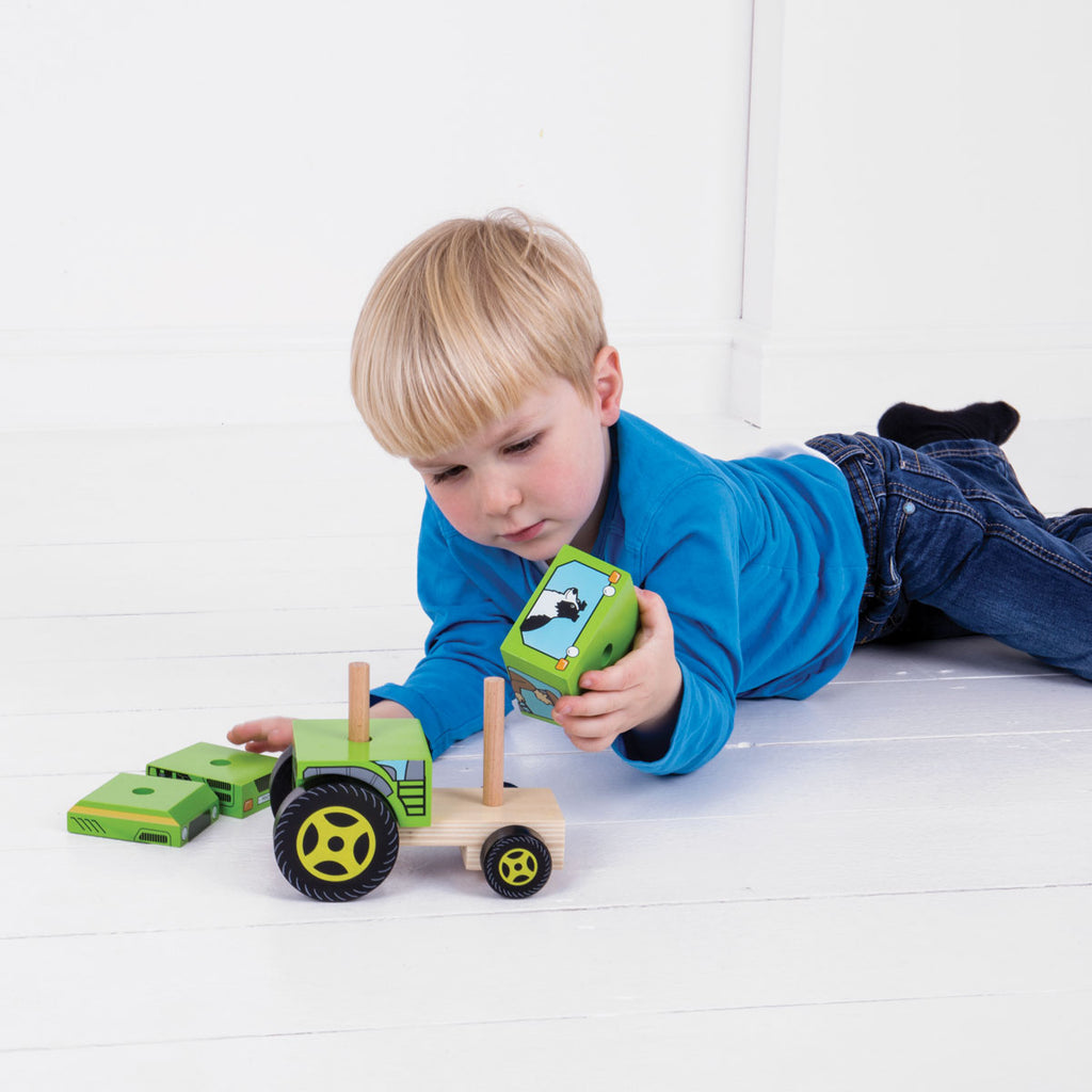 Boy Playing With A Bigjigs Wooden Stacking Tractor | Chocoloons