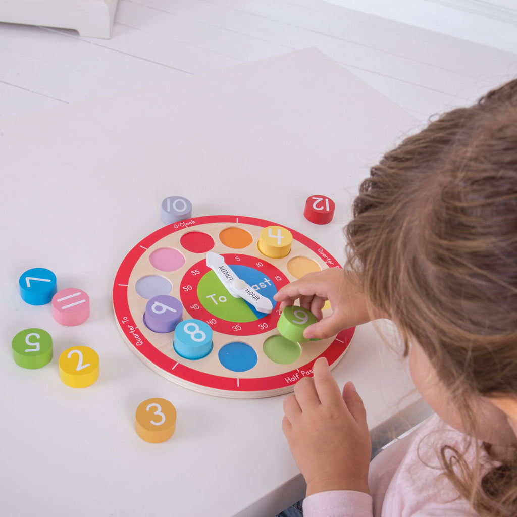 Girl Playing With A Big Jigs Wooden Teaching Clock | Chocoloons