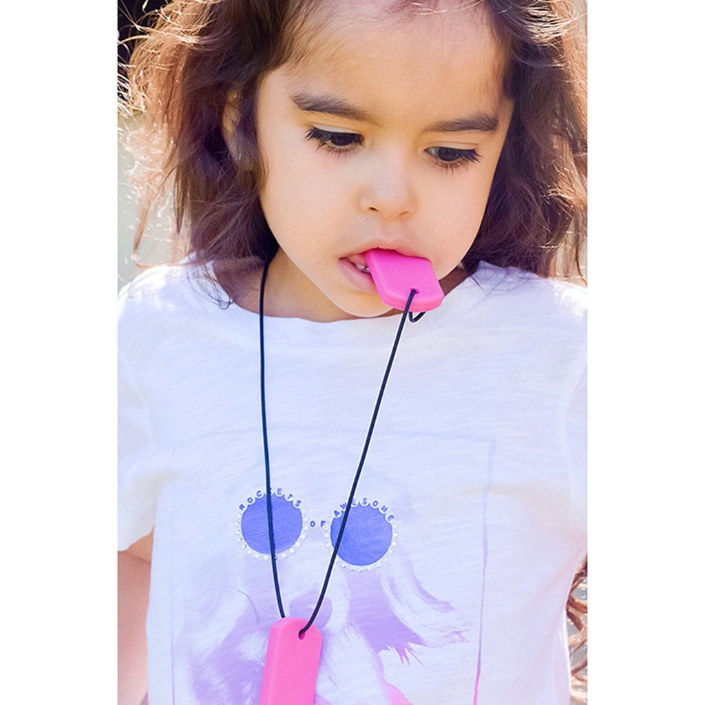 Girl Wearing A Sensory Chew Tags Necklace | Pink Oral Chew | Chocoloons